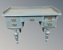 A 19th century Scandinavian painted pine writing table fitted with five drawers.