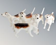 Five Beswick beagles. CONDITION REPORT: One with broken tail.