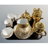 A tray of Royal Worcester and Royal Standard part gold plated tea sets