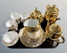 A tray of Royal Worcester and Royal Standard part gold plated tea sets