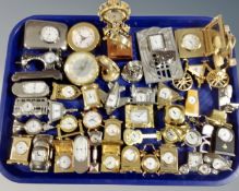 A tray of miniature timepieces