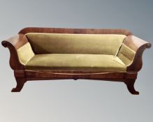 A 19th century mahogany Biedermeier scroll arm hall settee.