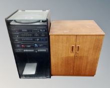 An Alba hifi system in cabinet including semi-automatic belt drive turntable, stereo tuner,