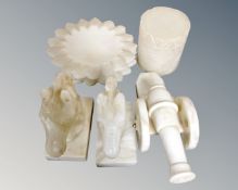 A tray of Alabaster ornaments, pair of horse head bookends, cannon ornaments,