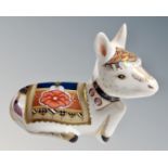 A Royal Crown Derby Donkey Foal paperweight with silver stopper.