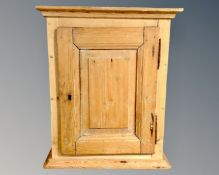 A nineteenth century pine single door wall cabinet,