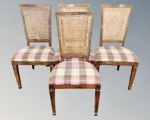 A set of four contemporary bergere backed dining chairs in tartan upholstery