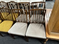 A set of four 20th century beech railback dining chairs.