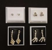 Two pairs of diamante drop earrings and stud earrings.