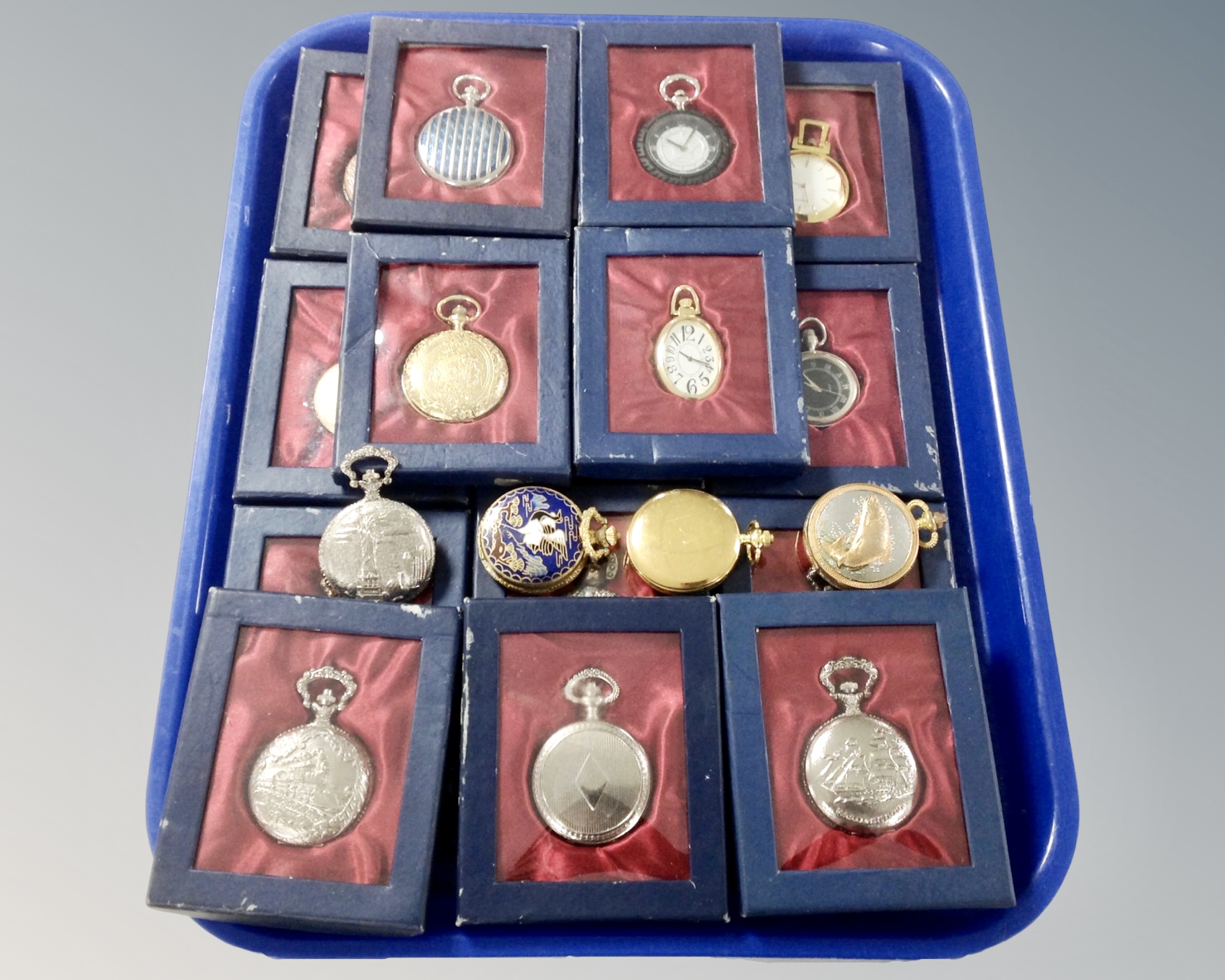 A tray of approximately 20 mostly boxed modern pocket watches.