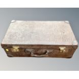 A vintage faux crocodile skin luggage case