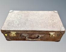 A vintage faux crocodile skin luggage case