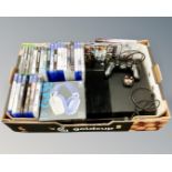 A box of Sony Playstation 4 with lead controller and games,