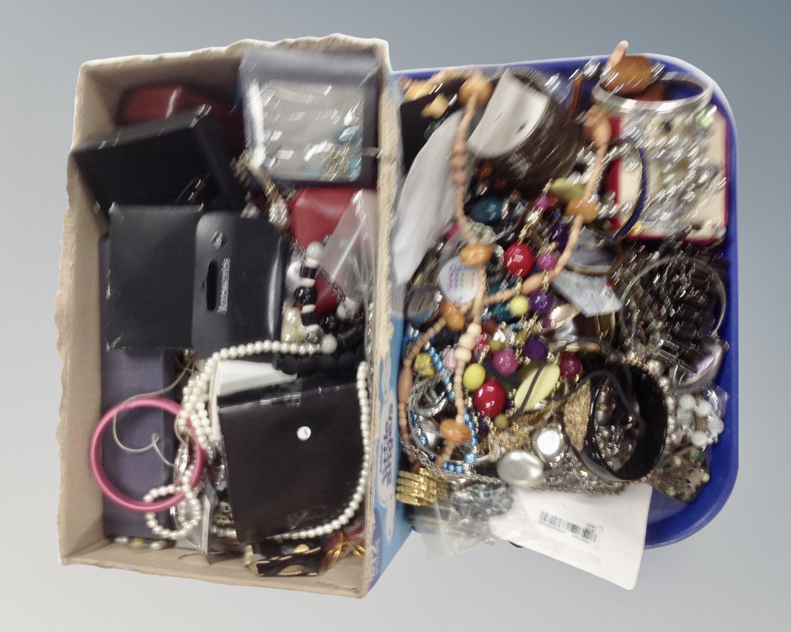 A tray containing a large quantity of costume jewellery.