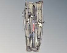 A Crane Sports fishing rod bag containing beach casting rods together with two reels,