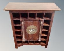 A Chinese style double door cabinet/wine rack.