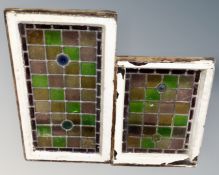 Two antique stained leaded glass windows in frames
