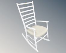 A painted ladder backed rocking chair