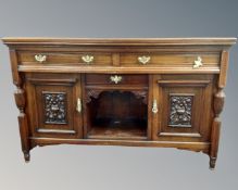 A late Victorian walnut sideboard,