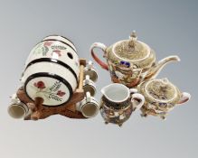 A Japanese export satsuma teapot with matching milk jug and sugar pot,