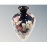 A Moorcroft wild cyclamen bud vase (height 16cm)