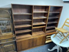 A mid-20th century Danish rosewood effect open bookcase fitted with cupboards below.