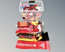 A box containing a large quantity of sports scarves.