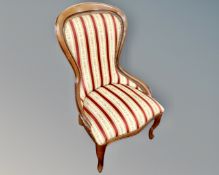 A Victorian style lady's chair upholstered in a classical fabric.