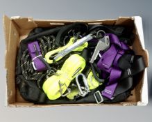 A duffel bag containing climbing ropes and harnesses.