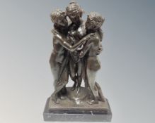 A bronze figure of the three graces, on marble socle,