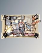 A box containing wooden tribal items including masks, treen, pair of candlesticks etc.