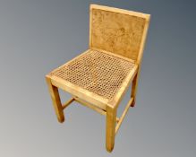 A cane seated dressing table chair