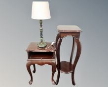 A telephone table on raised legs together with a two tier plant stand, both in a mahogany finish,