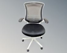 An office armchair upholstered in a black mesh fabric (white)
