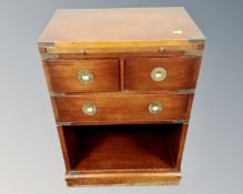 A mahogany brass bound telephone stand fitted with three drawers.
