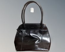 An Osprey of London black leather handbag.