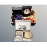 A box containing a deed box with key, cash box with key, riding hat, casserole dish,