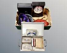 A box containing a deed box with key, cash box with key, riding hat, casserole dish,