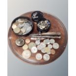 A 19th century mahogany circular tray (diameter 24cm) together with assorted coinage,