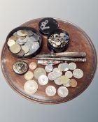 A 19th century mahogany circular tray (diameter 24cm) together with assorted coinage,