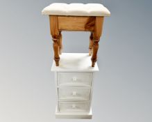 A painted pine three drawer bedside chest together with pine dressing table stool