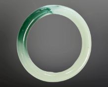 A carved jade circular bangle, inner diameter 58mm.