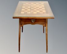 A 19th century mahogany occasional table fitted a drawer with chessboard top