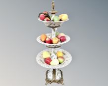 A three-tier porcelain and gilt metal table centrepiece comport,