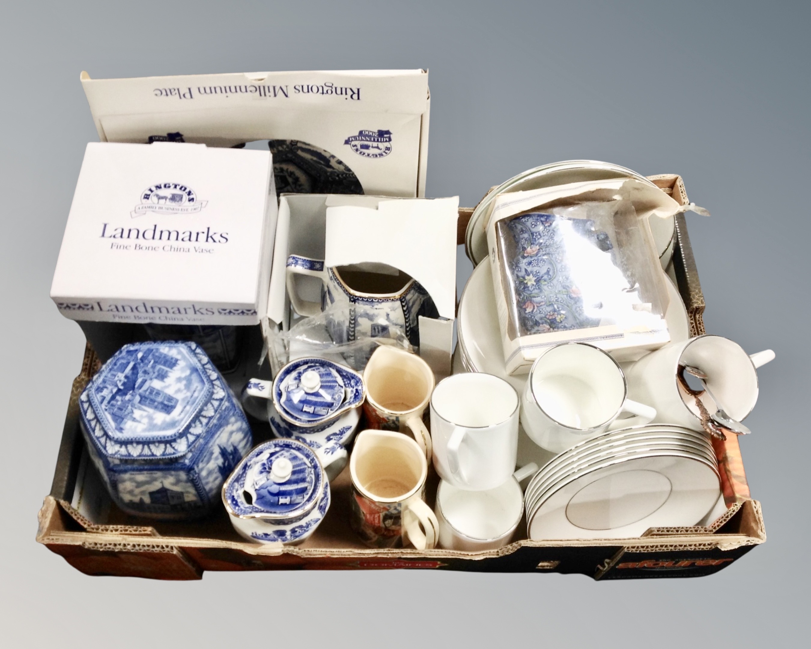 A box of boxed and unboxed Ringtons blue and white china, Wedgwood Jasper Conran dinner china etc.