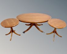 A Bradley Furniture Yew wood oval pedestal coffee table together with pair of matching lamp tables