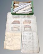 A box containing a large quantity of rolled architectural plans.