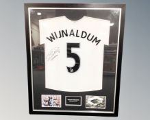 A Georginio Wijnaldum signed Newcastle United shirt with accompanying photographs in mount,