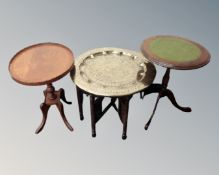 An Indian folding brass topped table together with two wine tables.
