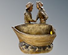 A German Johann Maresch figure group planter depicting two sailors by a boat, stamped BU533.